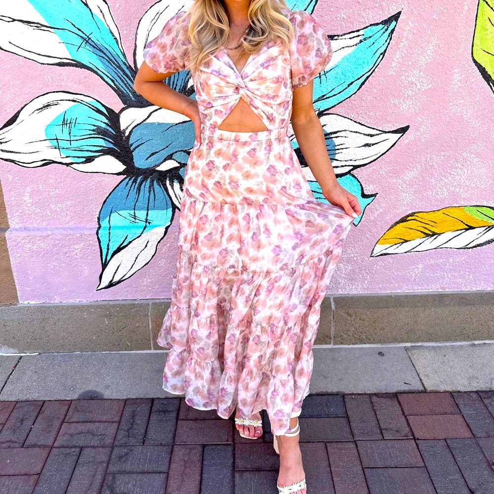 Long floral midi dress with cutout and poof shoulder.